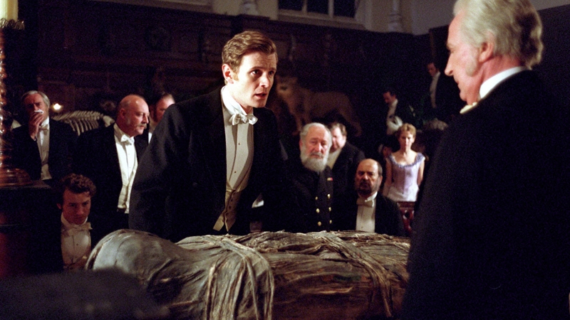 The public unwrapping of an Egyptian mummy in a scene from Murder Rooms: The Kingdom of Bones