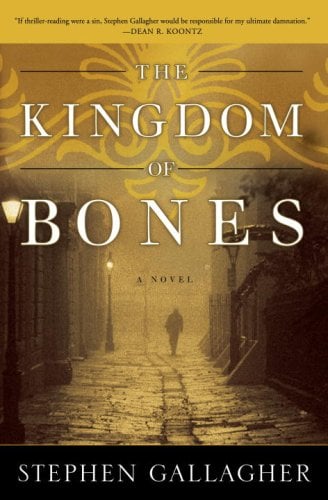 American paperback cover for The Kingdom of Bones. A lonely figure seen in the distance in a misty gaslit street, He's walking away. The immiage is suffused with a rather fetching golden light.