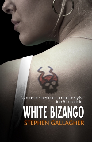 Paperback cover for White Bizango, closeup of a woman's shoulder with a flaming skull tattoo